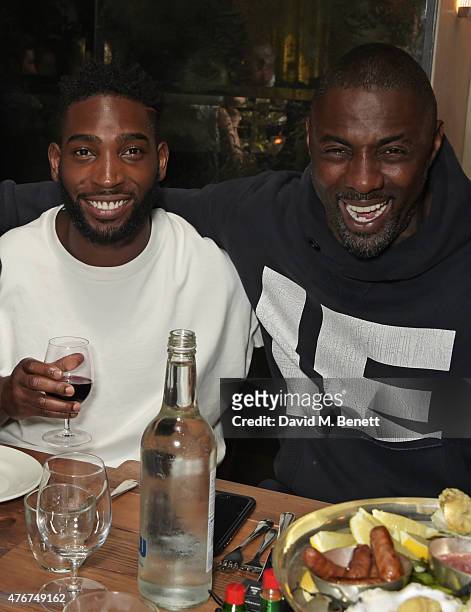 Tinie Tempah and Idris Elba attend the official Idris Elba + Superdry presentation at LCM at Hix on June 11, 2015 in London, England.