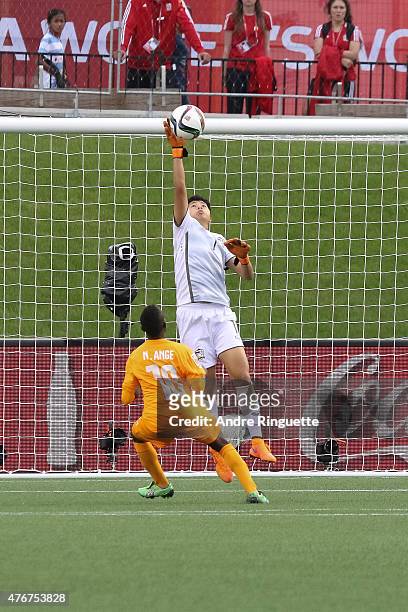 Waraporn Boonsing of Thailand reaches for a save against Ange N'Guessan of Cote d'Ivoire during the FIFA Women's World Cup Canada 2015 Group B match...