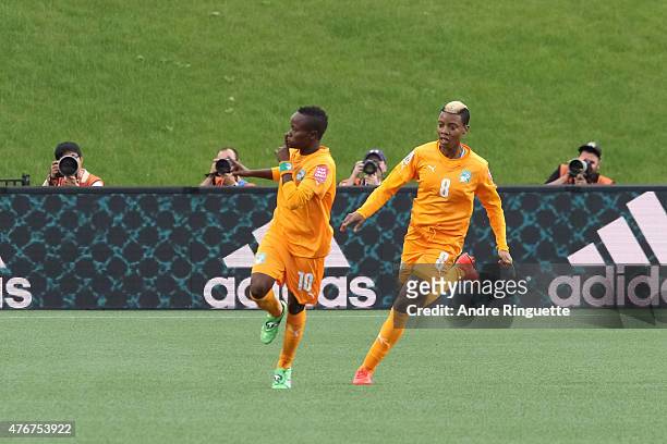 Ange N'Guessan of Cote d'Ivoire celebrate her goal with team mate Ines Nrehy during the FIFA Women's World Cup Canada 2015 Group B match between Cote...