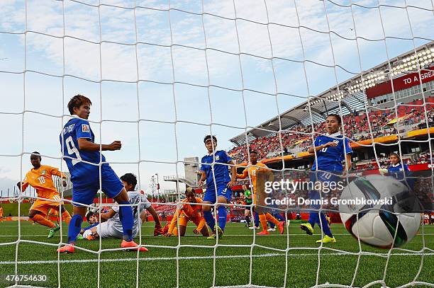 Ange Nguessan of Cote D'Ivoire scores the opening goal during the FIFA Women's World Cup Canada 2015 Group B match between Cote D'Ivoire and Thailand...