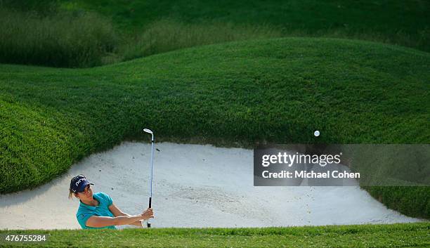 Azahara Munoz of Spain hits her third shot from a bunker on the seventh hole during the first round of the KPMG Women's PGA Championship held at...