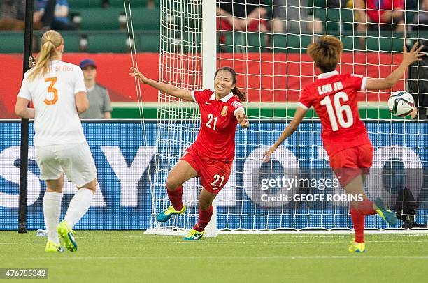 China's Wang Lisi celebrates her winning goal in China's Group A football match against the Netherlands at the FIFA Women's World Cup at Commonwealth...