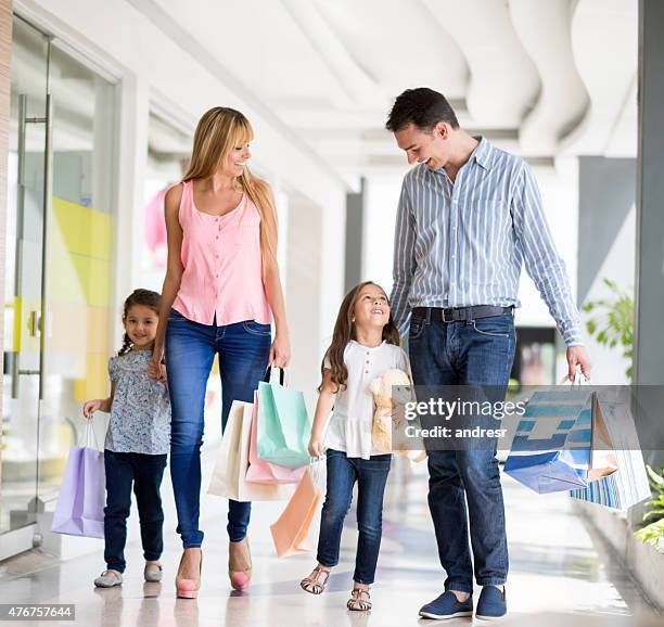 family shopping at the mall - family mall stock pictures, royalty-free photos & images