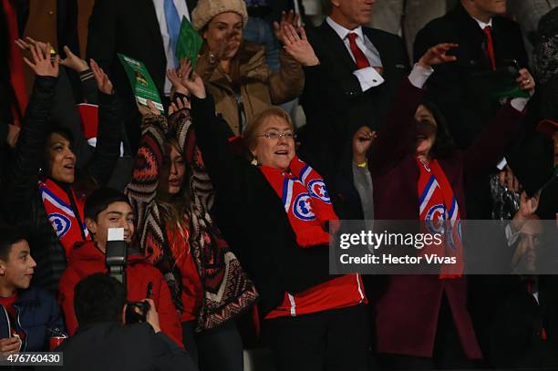 Michelle Bachelet, President of Chile waves her hands to cheer for her team during the 2015 Copa America Chile Group A match between Chile and...