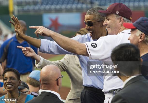 President Barack Obama greets members of the Democratic team during the annual Congressional Baseball Game between the Democrats and Republicans in...