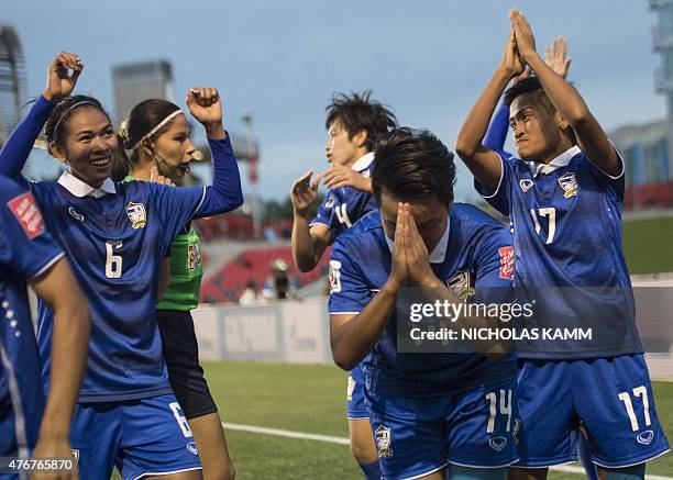 Thailand's Thanatta Chawong and teammates thank their fans after she scored the winning goal against Ivory Coast during a Group B match at the 2015...