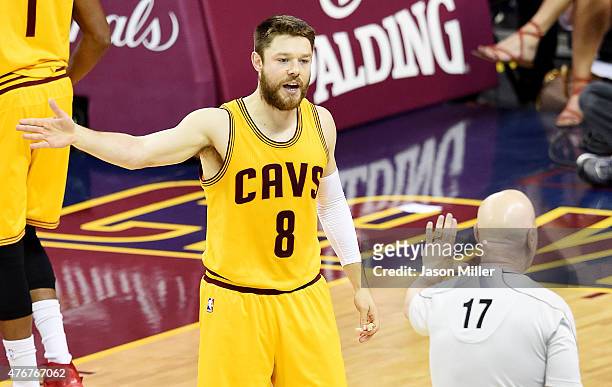 Matthew Dellavedova of the Cleveland Cavaliers argues a call with referee Joe Crawford in the first quarter against the Golden State Warriors during...