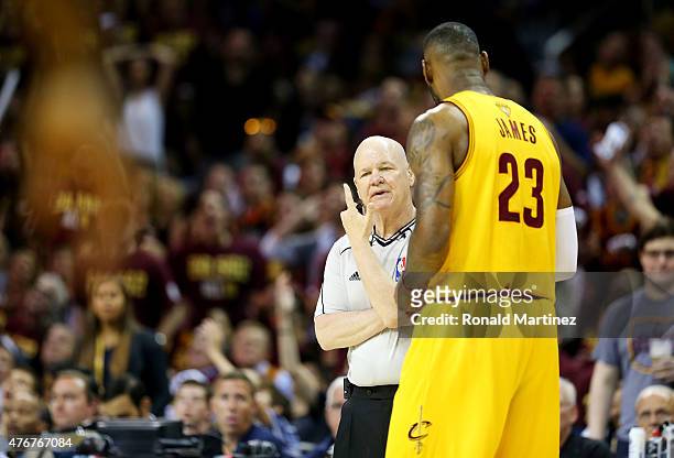 LeBron James of the Cleveland Cavaliers argues a call with referee Joe Crawford in the first quarter against the Golden State Warriors during Game...