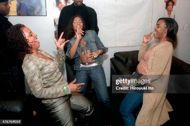 Ashanti , center, and her mother Tina Douglas, right, in the backstage of Brooklyn Cafe on Sunday night, April 27, 2002.