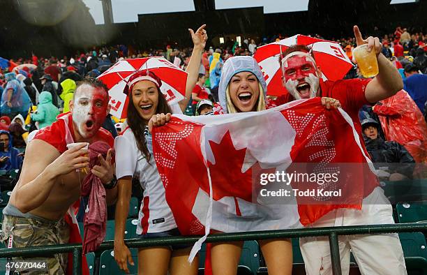 Canadian fans cheer during a rain delay in their match against New Zealand during the FIFA Women's World Cup Canada Group A match between China and...