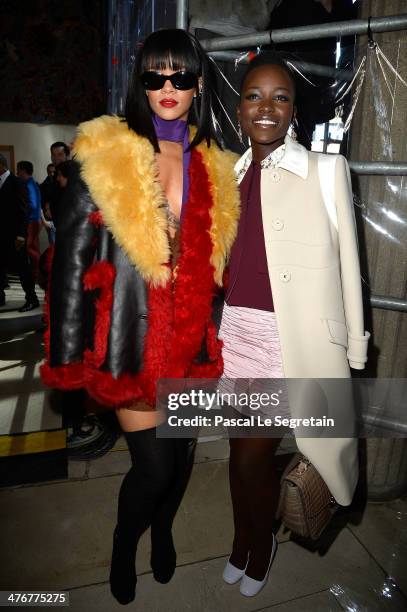 Singer Rihanna and actress Lupita Nyong'o attend the Miu Miu show as part of the Paris Fashion Week Womenswear Fall/Winter 2014-2015 on March 5, 2014...