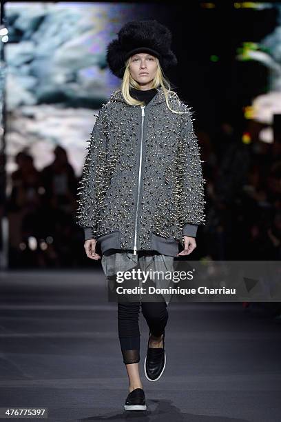 Model walks the runway during the Moncler Gamme Rouge show as part of the Paris Fashion Week Womenswear Fall/Winter 2014-2015 on March 5, 2014 in...