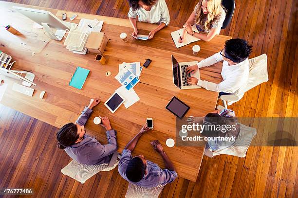 group of multi-ethnic business people meeting - cool office stockfoto's en -beelden