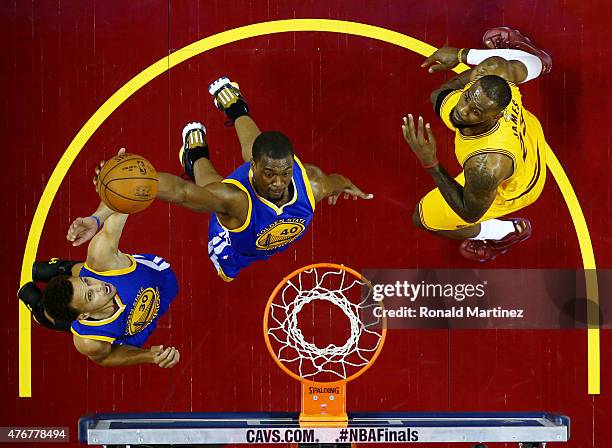 Harrison Barnes of the Golden State Warriors goes up against LeBron James of the Cleveland Cavaliers in the first half during Game Four of the 2015...