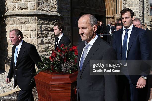 Craig Bond and John Bond lead the funeral prosession with the casket of their father Alan Bond following the service at St Patrick's Basilica on June...