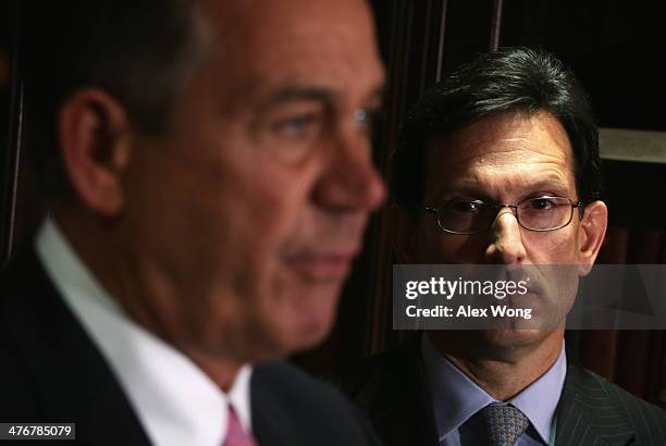 Speaker of the House Rep. John Boehner speaks as House Majority Leader Rep. Eric Cantor looks on during a briefing March 5, 2014 at the headquarters...