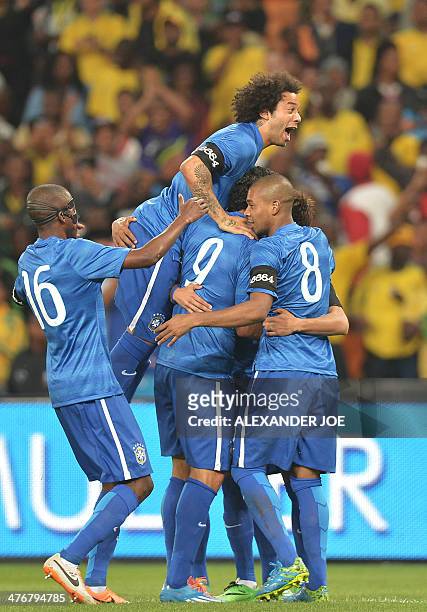 Brazil's players celebrates after scoring a goal during a friendly football match between South Africa and Brazil at Soccer City stadium in Soweto,...