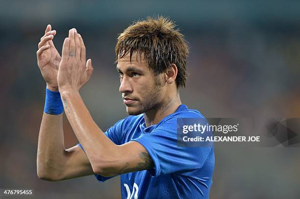 Brazil's forward Neymar celebrates at the end of a friendly football match between South Africa and Brazil at Soccer City stadium in Soweto, outside...