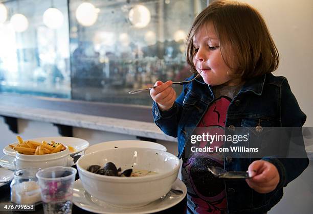 Catherine Luhn eats mussels and frites at Bearnaise restaurant on Pennsylvania Avenue, SE. Catherine is owner Spike Mendelsohn's niece.