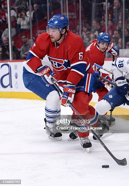 Douglas Murray of the Montreal Canadiens looks to pass the puck against the Toronto Maple Leafs during the NHL game on March 1, 2014 at the Bell...