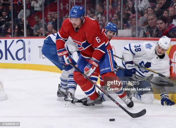 Douglas Murray of the Montreal Canadiens looks to pass the puck against the Toronto Maple Leafs during the NHL game on March 1, 2014 at the Bell...