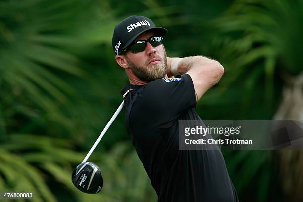 Graham DeLaet of Canada hits a shot during a practice round prior to the start of the World Golf Championships-Cadillac Championship at Trump...