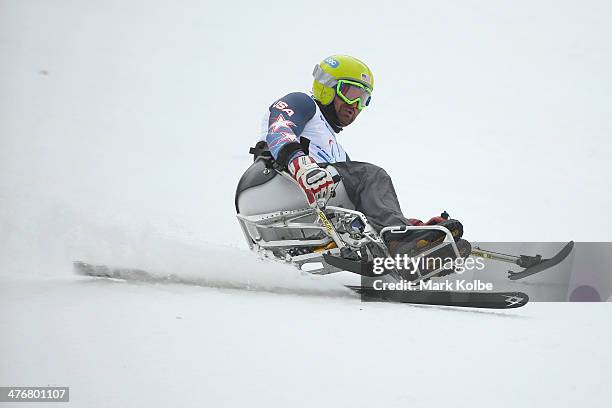 Jasmin Bambur of the USA finishes after his run during an official men's sitting skiing training session at Rosa Khutor Alpine Center ahead of the...