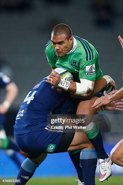 Patrick Osborne of the Highlanders ia tackled during the round 18 Super Rugby match between the Blues and the Highlanders at Eden Park on June 12,...