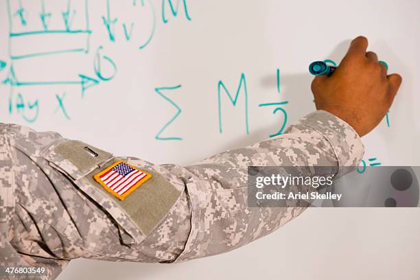 black soldier writing on whiteboard - military arm bildbanksfoton och bilder