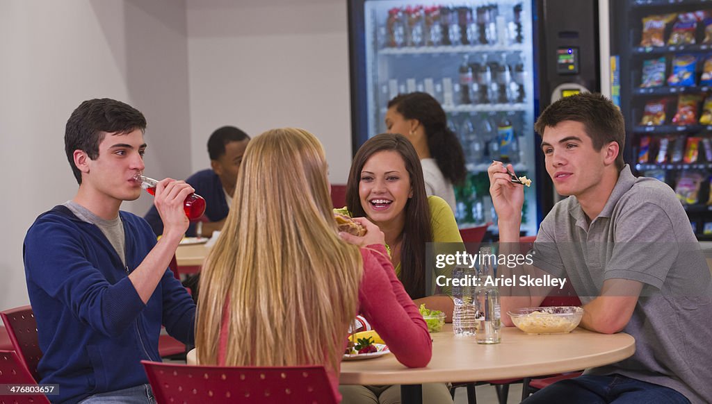 Friends eating together in lunchroom