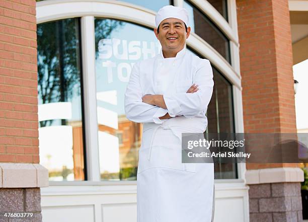 japanese chef standing outside restaurant - sushi chef stock pictures, royalty-free photos & images