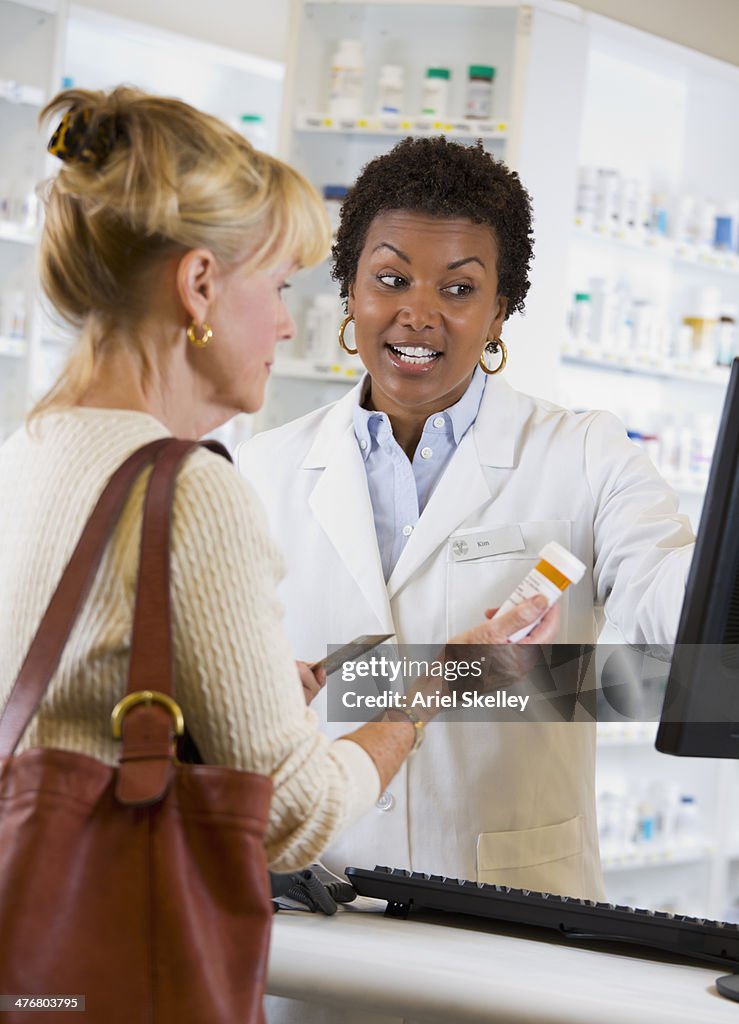 Customer talking to pharmacist