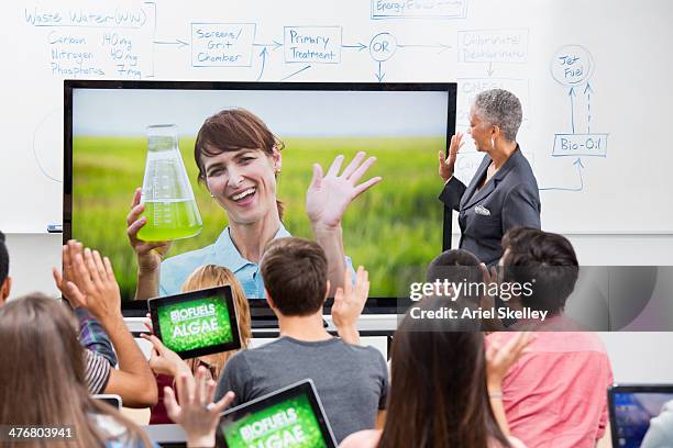professor and scientist teaching via video conference - television academy stock pictures, royalty-free photos & images