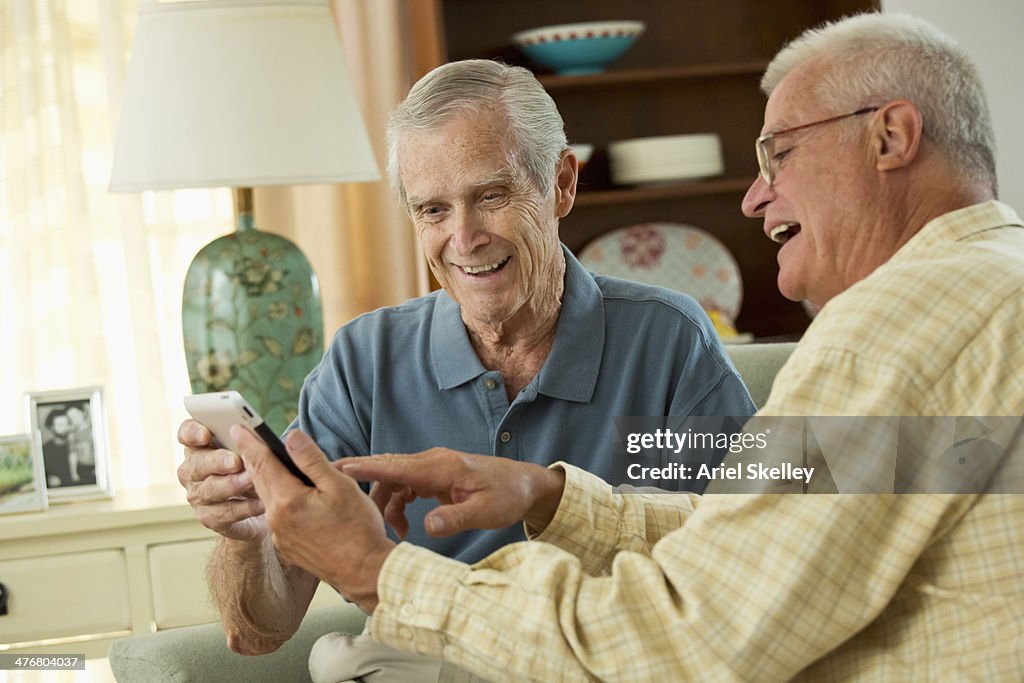 Senior Caucasian men using digital tablet