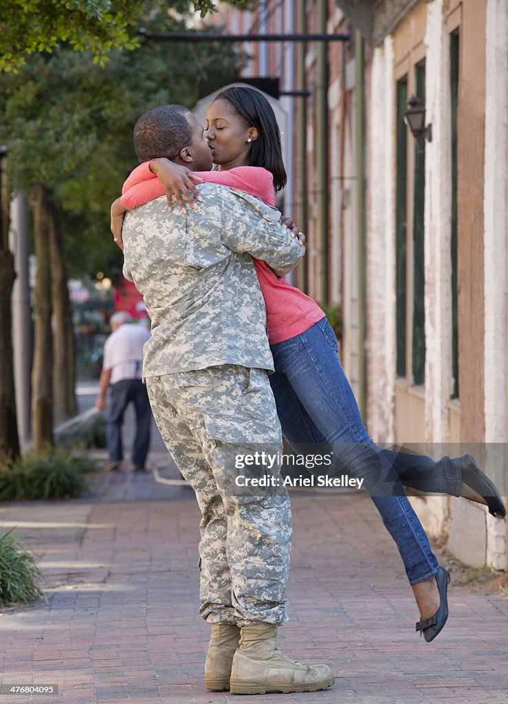 Woman greeting returning soldier