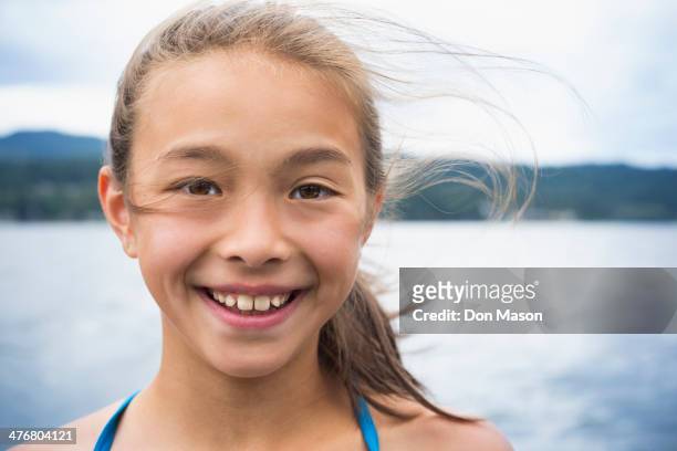 mixed race girl smiling - lake whatcom foto e immagini stock
