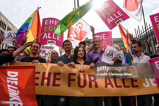 Berlin's Integration Senator Dilek Kolat poses with activists with the Lesbian and Gay Association of Berlin demonstrate outside the Bundesrat,...