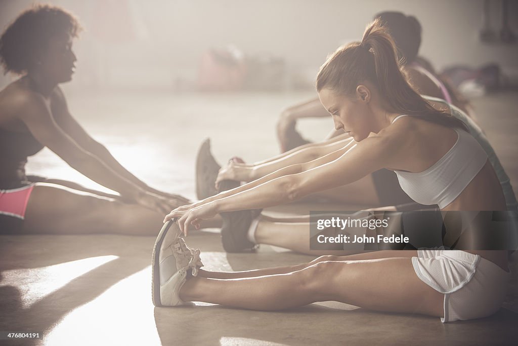 Women stretching in gym