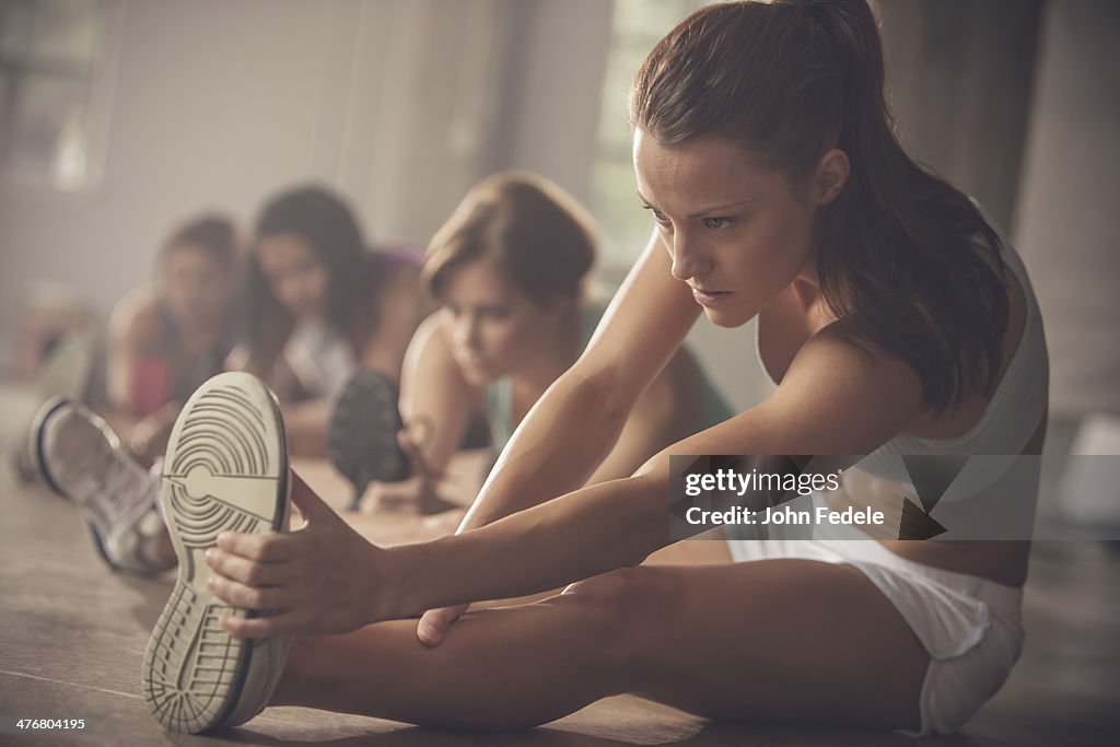 Women stretching in gym