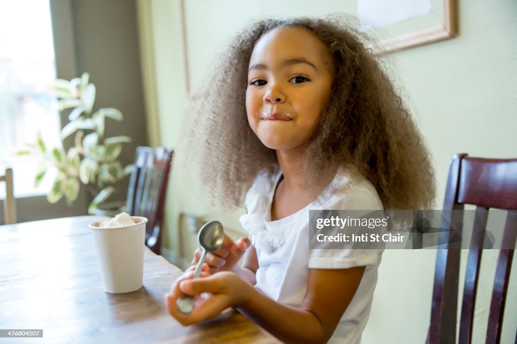 Mixed race girl enjoying hot chocolate