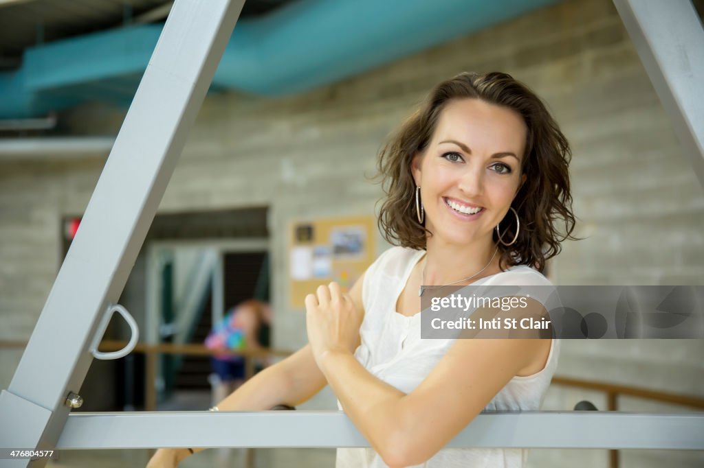 Caucasian woman smiling in gym