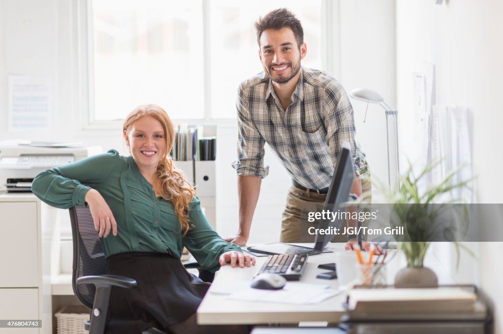 Business people smiling together in office