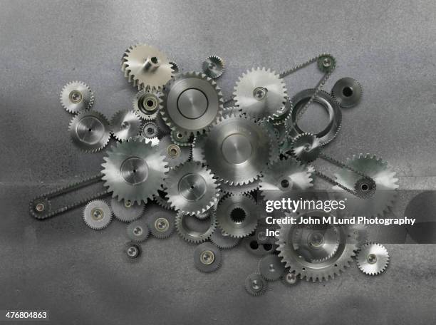 metal cogs - cogs machine stock pictures, royalty-free photos & images