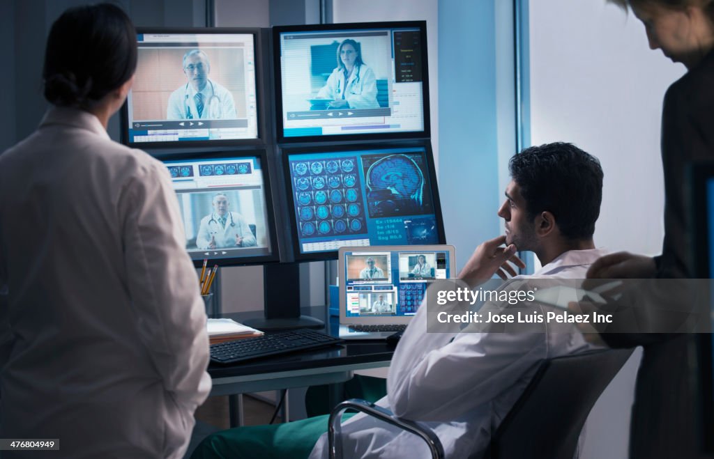 Doctors examining x-rays in video conference