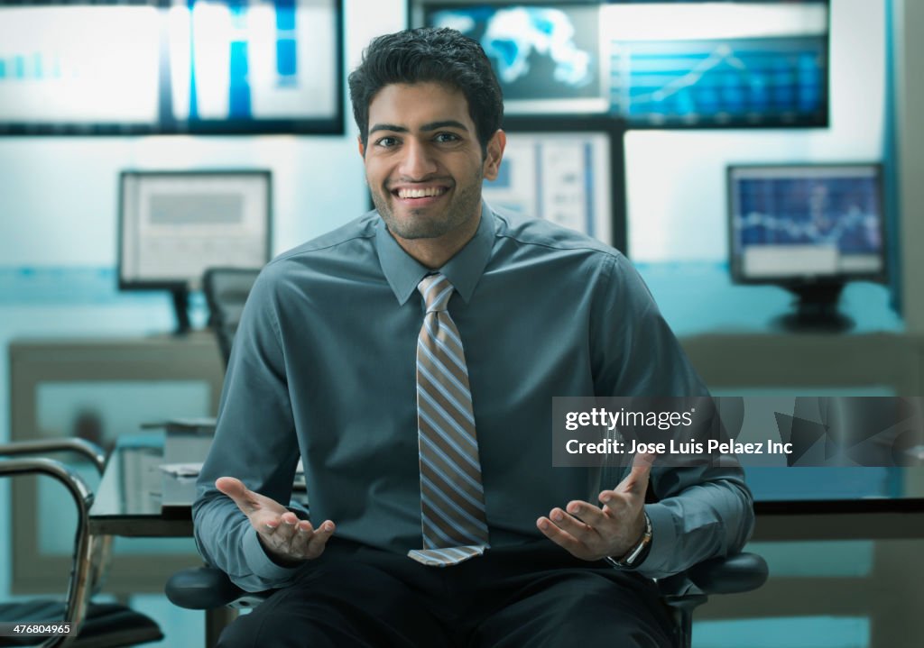 Businessman laughing in office