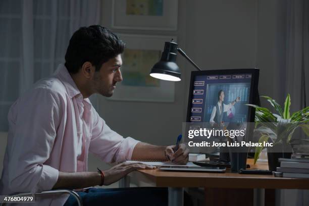 businessman working at desk at home - mejora personal fotografías e imágenes de stock