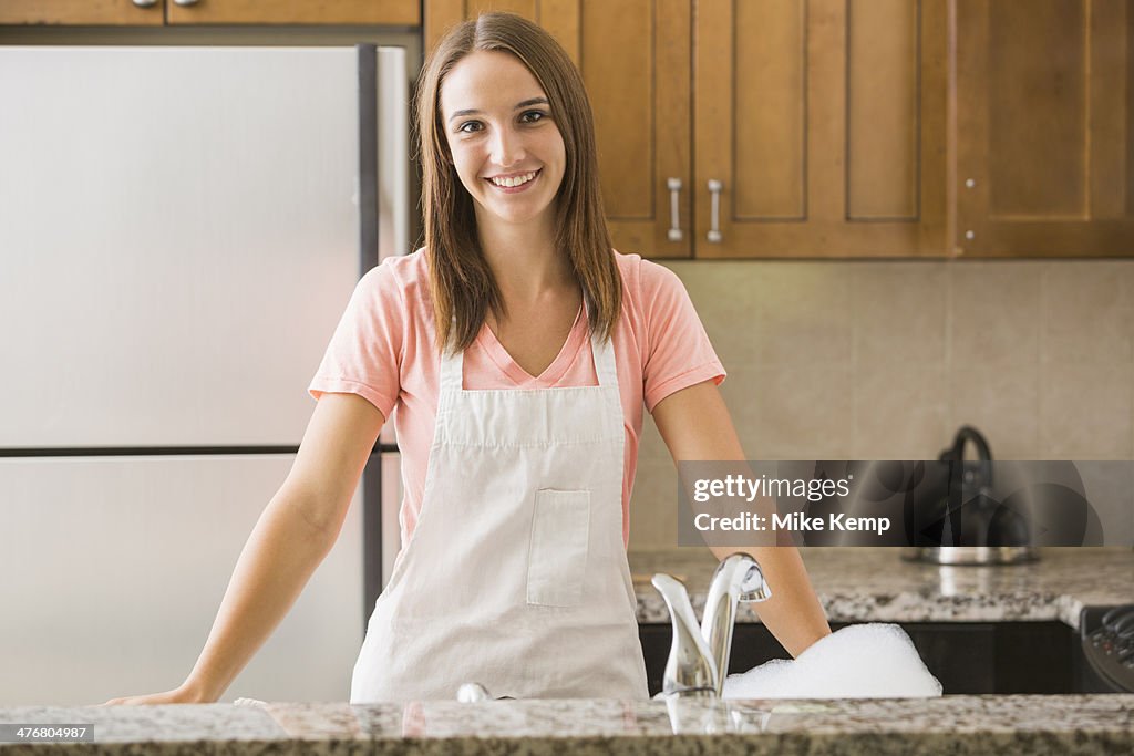 Caucasian woman smiling in kitchen