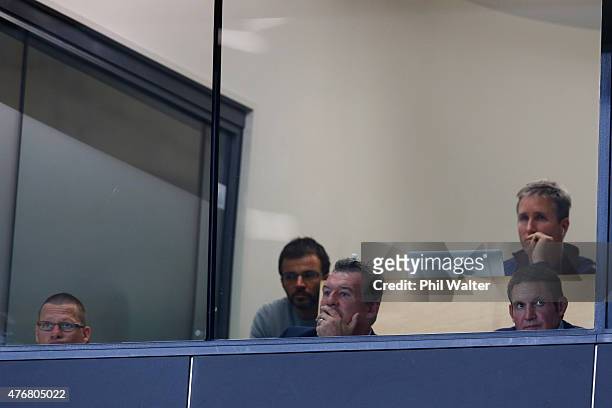 Sir John Kirwan and the Blues coaching staff watch the game during the round 18 Super Rugby match between the Blues and the Highlanders at Eden Park...