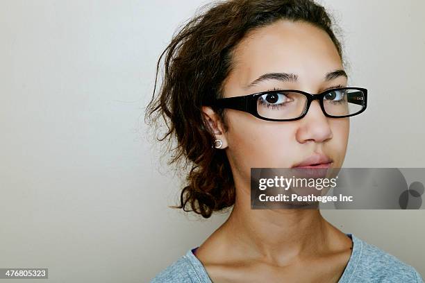 mixed race teenage girl wearing eyeglasses - mixed age range stock-fotos und bilder