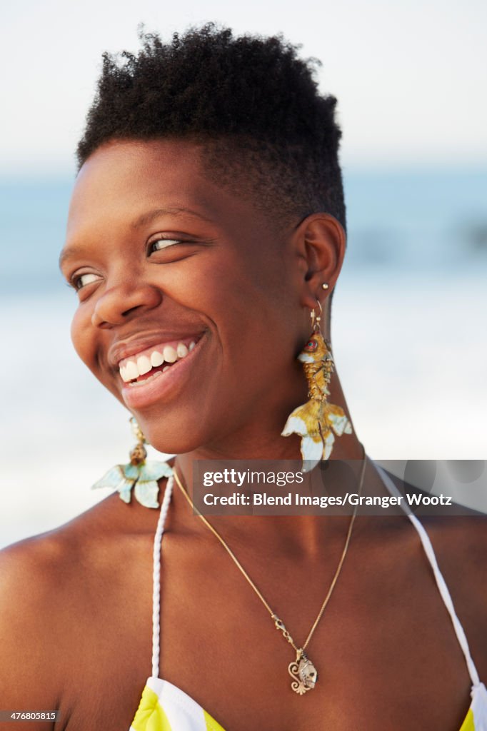 African American woman smiling on beach